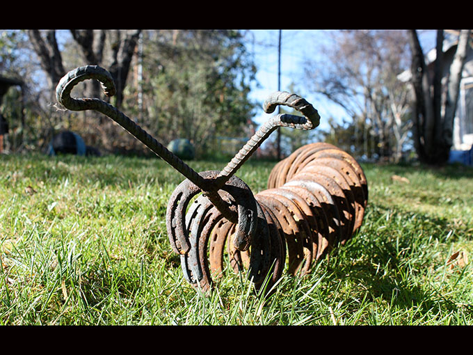 caterpillar metalwork rusty metal horse shoe art sculpture welding jeremy criswell jacksonville oregon public art