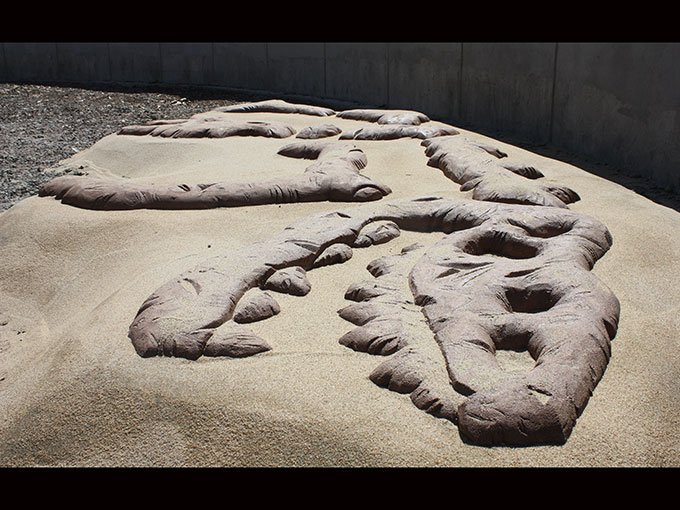 Oregon Hills Park public art project cement dinosaur bones